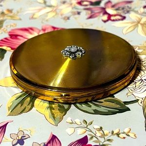 Vintage golden powder compact